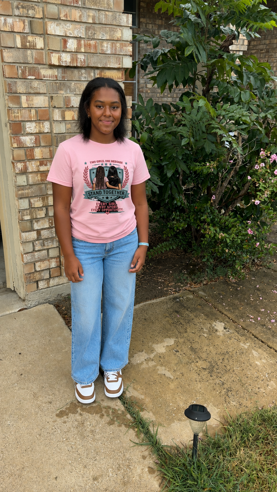 Stand Together Women's Baby Tee — "Stand Together: Every Girl. Every Sport. Every Opportunity."
