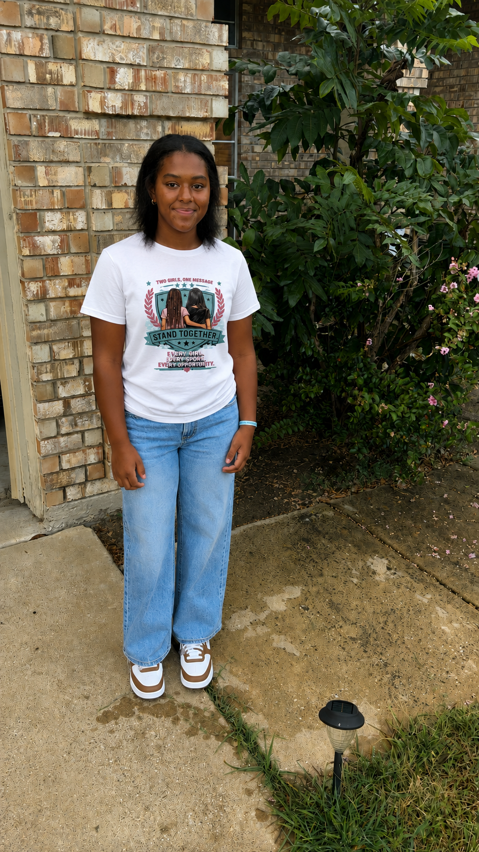 Stand Together Women's Baby Tee — "Stand Together: Every Girl. Every Sport. Every Opportunity."